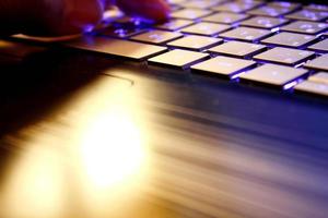 man using laptop, searching web, browsing information, having workplace at home, soft focus picture, Vintage concept, night photo