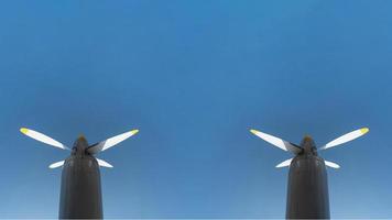 Two airplane propeller of military aircraft, copy space. Blue sky background. photo