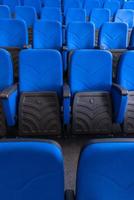 hall with rows of blue seats photo