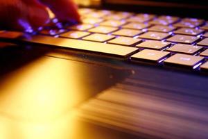 man using laptop, searching web, browsing information, having workplace at home, soft focus picture, Vintage concept, night photo
