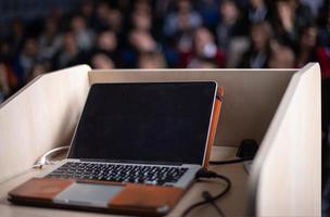 laptop computer at podium photo