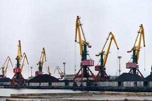 Harbor cranes, container ship terminal, cargo container yard photo