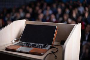 laptop computer at podium photo