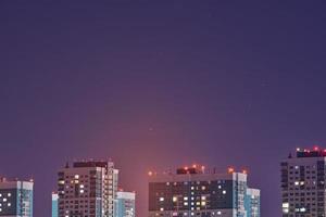 Multistorey buildings at night lights, photo