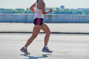 Running woman on street road photo