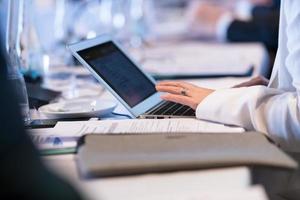 close up of business people hands using laptop computer photo