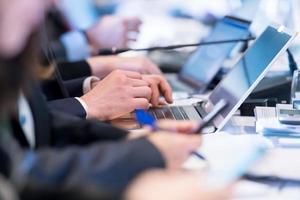 close up of business people hands using laptop computer photo