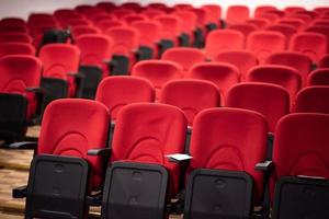 hall with rows of red seats photo