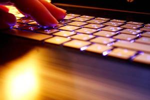 man using laptop, searching web, browsing information, having workplace at home, soft focus picture, Vintage concept, night photo