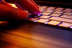 man using laptop, searching web, browsing information, having workplace at home, soft focus picture, Vintage concept, night photo