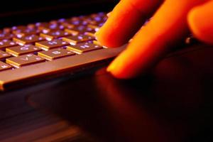 man using laptop, searching web, browsing information, having workplace at home, soft focus picture, Vintage concept, night photo