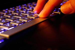 man using laptop, searching web, browsing information, having workplace at home, soft focus picture, Vintage concept, night photo