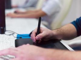 Closeup of Graphic Designer Working at Workplace photo