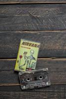 Bangkok Thailand - January ,22 2022  90's cassette tapes of Nirvana Album Incesticide on a black wooden floor. photo