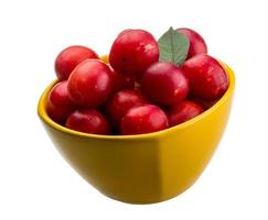 Damson plum in a bowl on white background photo