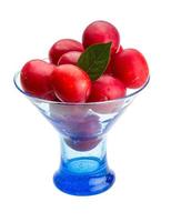 Damson plum in a bowl on white background photo