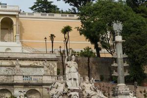 Rome, Italy, 2022 - sculpture and fountain of Piazza del Popolo . The steps lead up to the pincio park, Rome, Italy photo