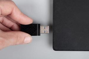 wifi booster for laptop, hand insert 5g on netbook photo