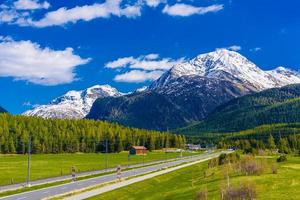 Road with Alps mountains, Samedan, Maloja, Graubuenden, Switzerl photo