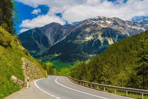 Road among Alps mountains, Klosters-Serneus, Davos, Graubuenden photo