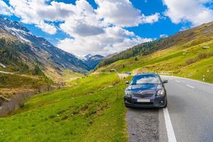 SWITZERLAND, DAVOS - MAI 2017 Toyota Avensis T25 in Alps mountains, Fluelapass, Davos, Graubu photo