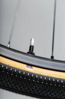 Presta bicycle nipple on the rim for swapping wheels photo