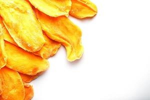 Dried mango sliced on a white background with free space photo