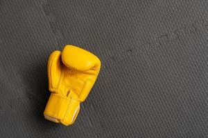 yellow boxing gloves in Gym Fitness. photo