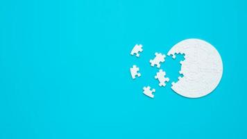 White part of jigsaw puzzle pieces on blue background. concepts of problem solving, business success, teamwork, Team playing jigsaw game incomplete, Texture photo with copy space for text