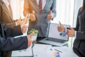 Group professional business people person working together to analyze in office, work together to discuss company financial statistics report, brainstorm ideas, and graph datum documents on the table. photo