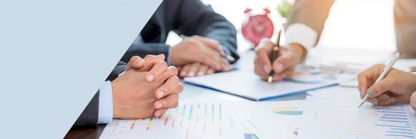 Banner of Group professional business people person working together analyze in office, work together to discuss company financial statistics report, brainstorm ideas graph datum documents on table. photo