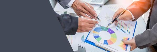 Banner of Group professional business people person working together analyze in office, work together to discuss company financial statistics report, brainstorm ideas graph datum documents on table. photo