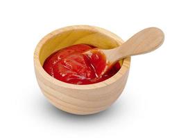 tomato sauce in wooden bowl and spoon isolated on white background ,include clipping path photo