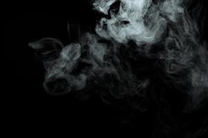 Abstract powder or smoke isolated on black background photo