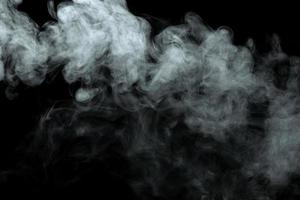 Abstract powder or smoke isolated on black background photo