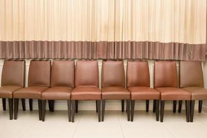 Row of Brown Wooden Chairs photo