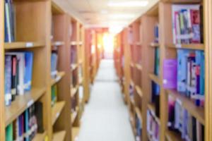 shelf with books in the library blurred background photo