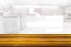 Empty wooden board space platform with register counter blurry background photo