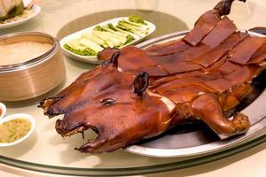 Barbecued suckling pig in restaurant photo