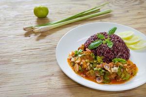 Salad mackerel in tomato sauce with cooked jasmine rice photo