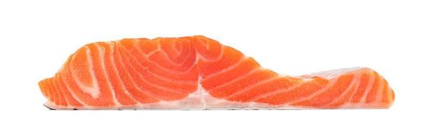 Piece of fresh salmon fillet sliced isolated on white background photo