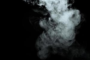 Abstract powder or smoke isolated on black background photo