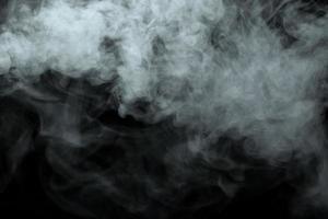 Abstract powder or smoke isolated on black background photo