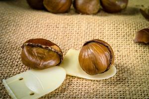 fresh chestnuts with sack bag background photo