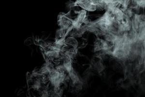 Abstract powder or smoke isolated on black background photo