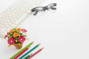 Color pencil and keyboard and flower pot,business concept photo