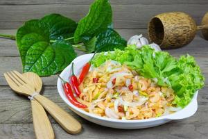 salad with dried shrimp on table photo