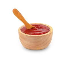 tomato sauce in wooden bowl and spoon isolated on white background ,include clipping path photo