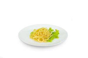 spaghetti with lettuce on white dish,isolated on white,clipping path. photo