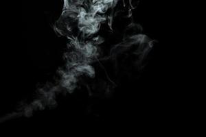 Abstract powder or smoke isolated on black background photo